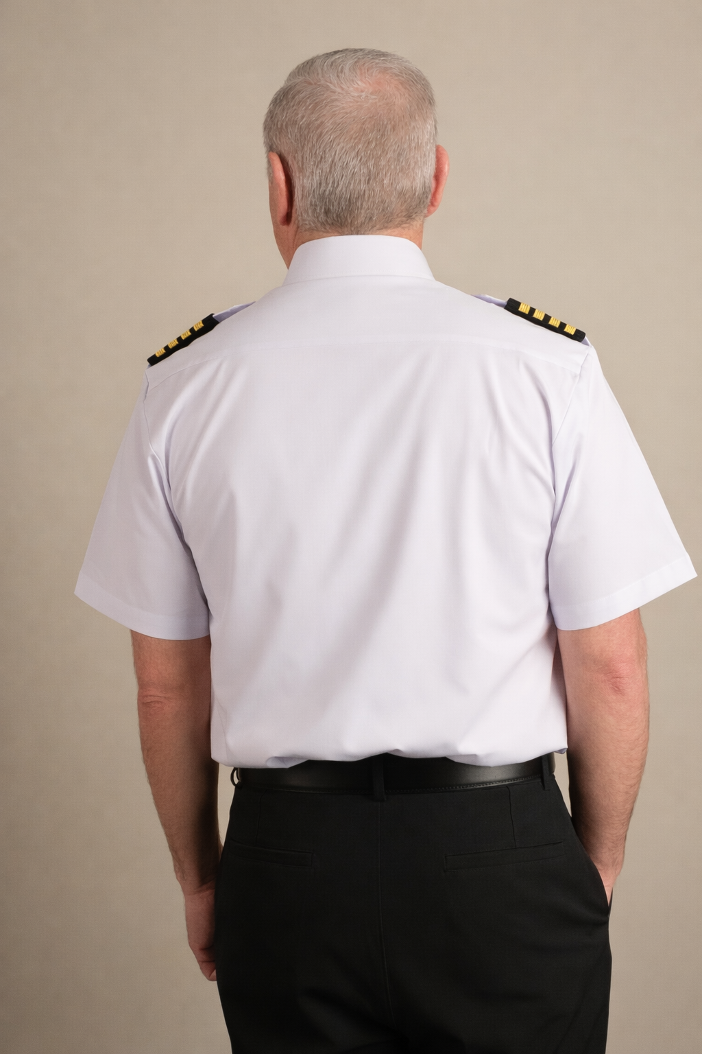 Back view of pilot wearing white Cloud Cotton uniform shirt with shoulder epaulettes